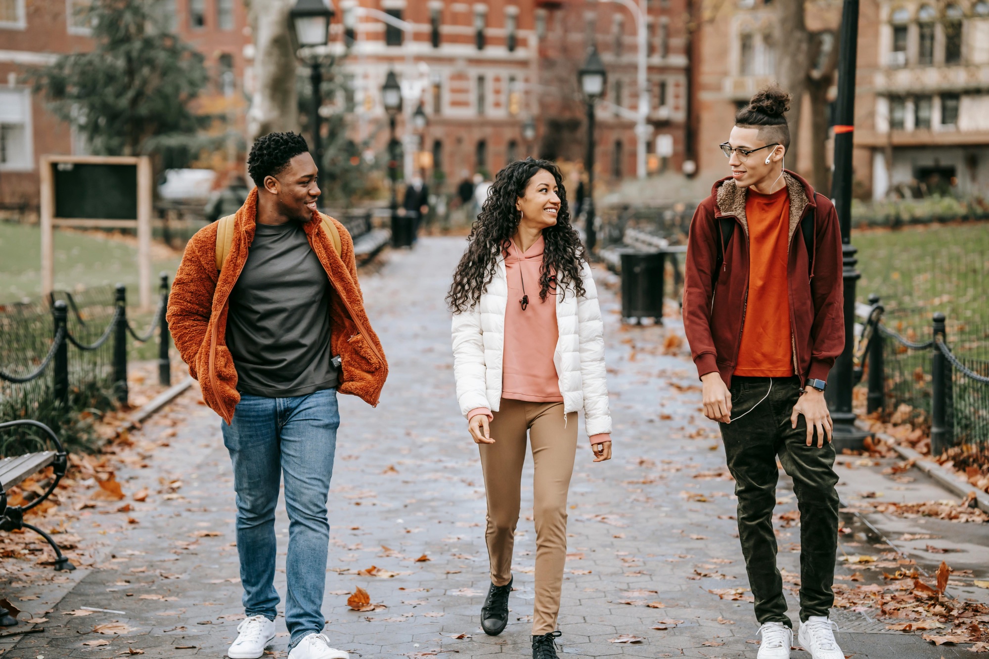 Three students talking on campus